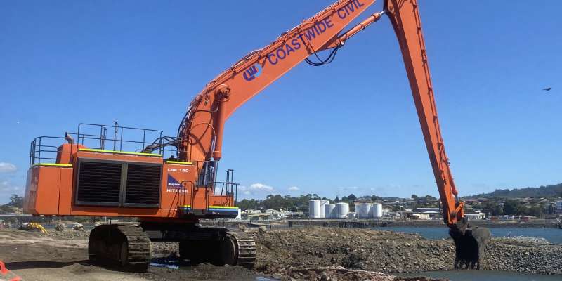 Giant cranes, trucks and long reach excavators